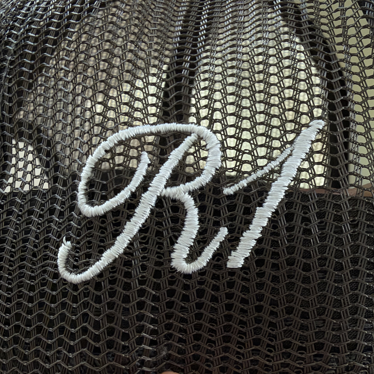 R1 embroidery on side mesh